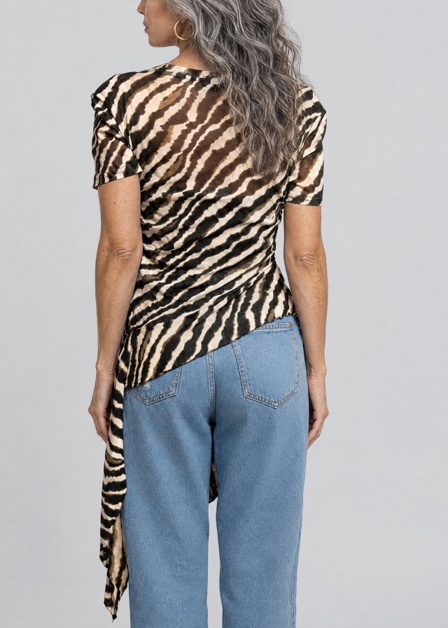 Lucía wearing Zebra Side Tie Asymmetrical Blouse, back